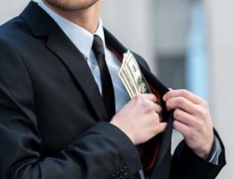 man with money in pocket