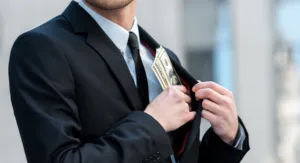 image of man pocketing cash