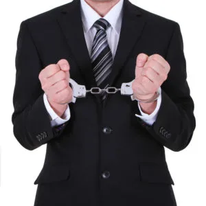 image of handcuffed man in suit