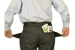 image of man with empty pockets hiding money
