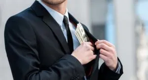 man with money in pocket